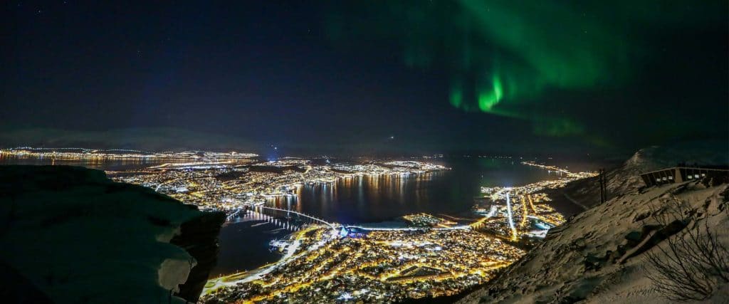 Tromsø city with northern lights. Photo.